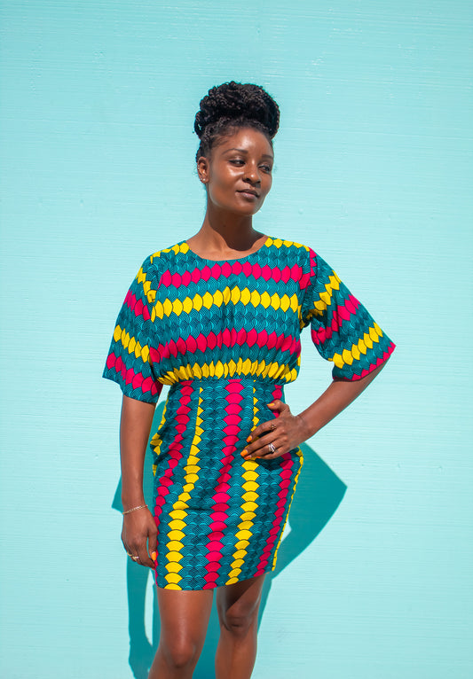 "Chima" is a Nigerian Igbo word meaning "God knows."  Short sleeve, round neck pencil shift dress cinched at the waist.  100% cotton.