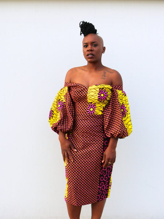 "Enu" is a Nigerian Igbo word for "high" or "elevated."  Off-shoulder midi pencil dress with a sweetheart neckline and three-quarter puffy sleeves.  100% cotton.