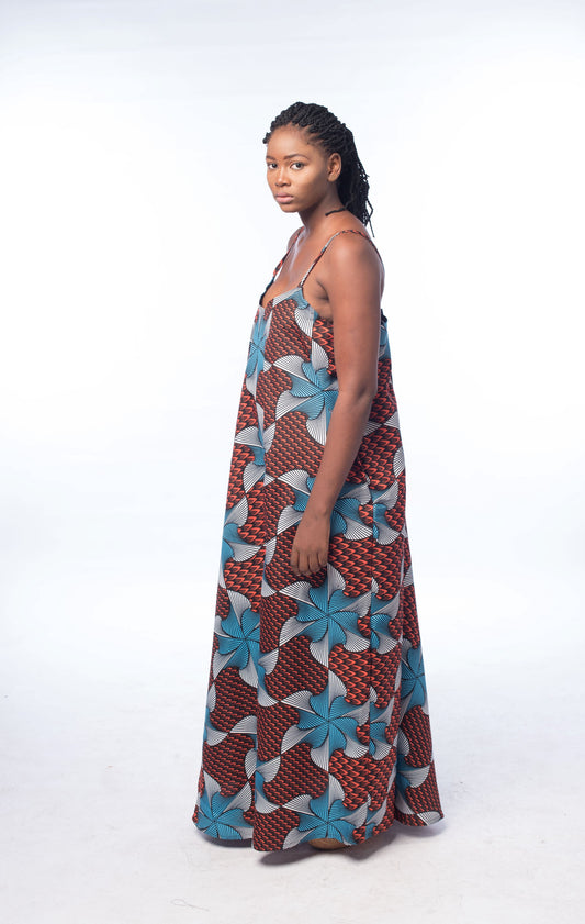 "Kene" is a Nigerian Igbo word meaning "thank"; used to express gratitude or appreciation.  Oversize Maxi Dress with a V-neck, tieback (that can be worn criss-cross), and a front slit. 100% cotton.