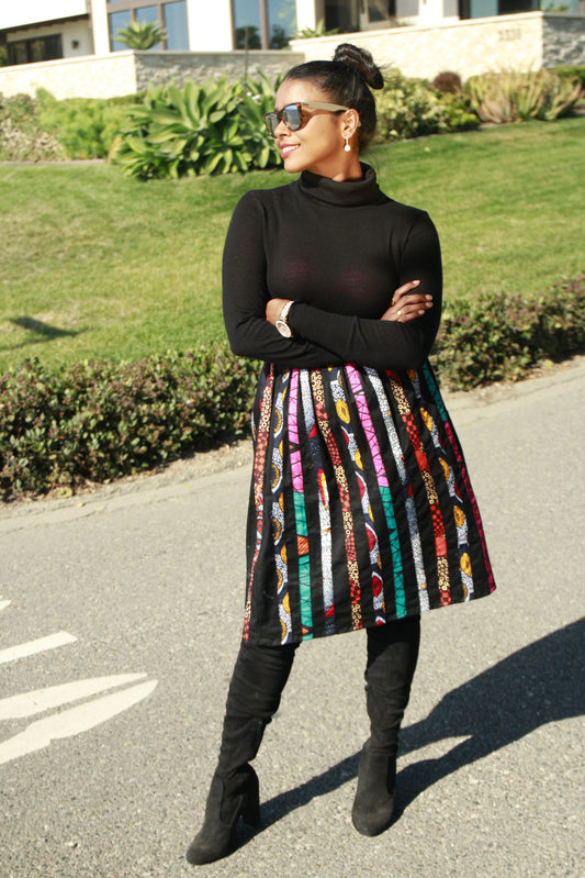 "Obi uto" is the Nigerian Igbo word for "happy" or "delighted."  Knee-length skirt with an elastic waistband  100% cotton  Note: elastic waistband will fit S/M or M/L