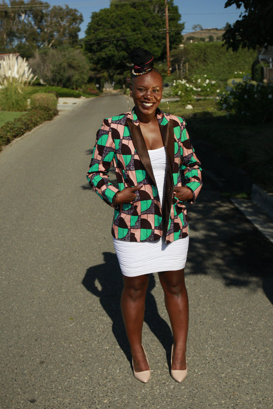 "Oma" is the Nigerian Igbo word for "good."  A ladies tuxedo blazer with a brown lapel.  100% cotton.