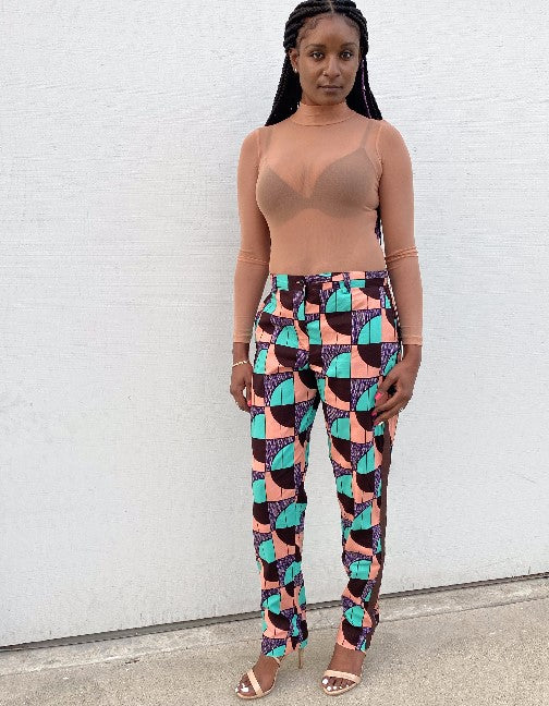 "Oma" is the Nigerian Igbo word which means "good."  Tuxedo pants with pockets and brown accent on the sides.  Handmade and 100% cotton.